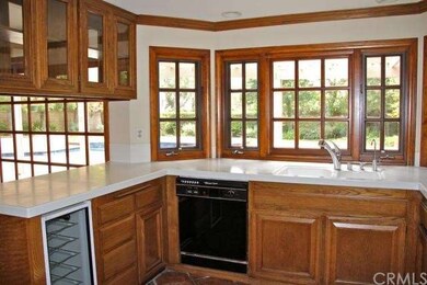 Kitchen with a view!  Beautiful wood windows, tray