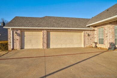 3 Car garage with 4th bay or work area, cabinet st