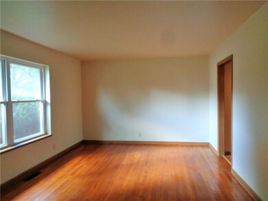 Formal Living room with hard wood floors. Freshly 