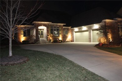 Outdoor lighting highlights the home at night