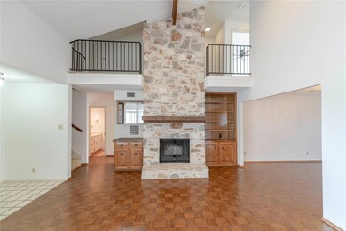 Unfurnished living room with high vaulted ceiling
