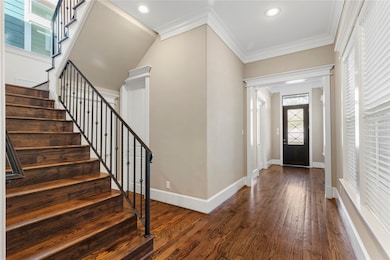The stunning staircase welcomes you upstairs to th