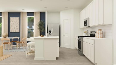 Kitchen featuring a kitchen bar, appliances with s