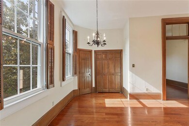 Cheerful dining room overlooks the brick courtyard