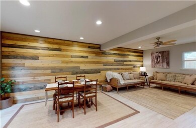 Dining area with beam ceiling, light wood-style fl