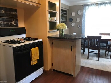 Hardwood floor in kitchen and dining room.  Open floor plan.