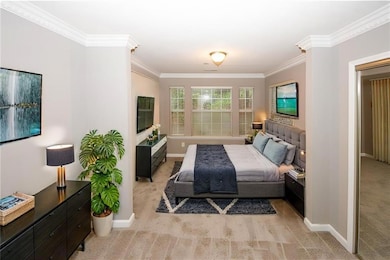 Carpeted bedroom with baseboards and ornamental mo