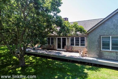 There is ample outdoor space to enjoy views of the Great Pond.