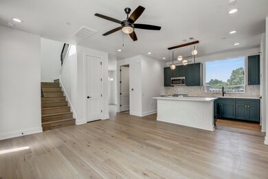 Kitchen featuring stainless steel microwave, back
