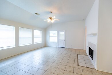 The living room is open and airy, with ample natur