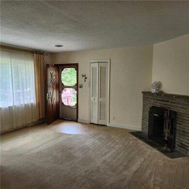 Spacious Living room with coat closet and wood bur