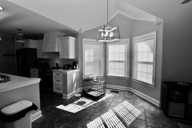 Kitchen featuring black appliances, ornamental mol