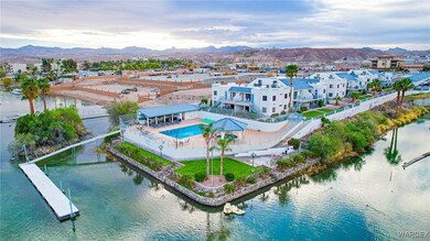 Birds eye view of property featuring a water and mountain view