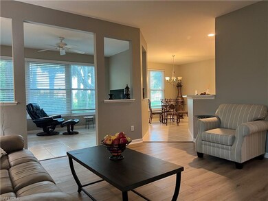 Sitting room featuring ceiling fan, baseboards, an