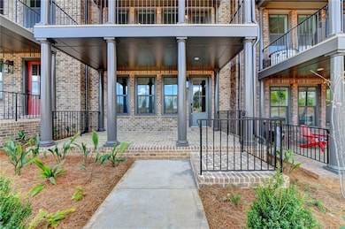 Entrance to property with a balcony