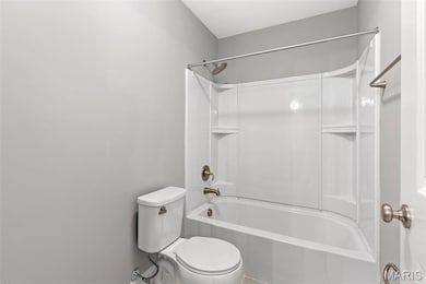 Bathroom featuring  shower combination and toilet