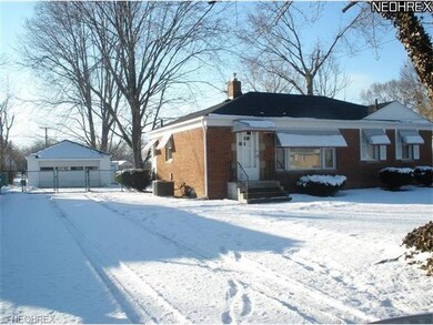 Paved drive, gated backyard and garage entrance