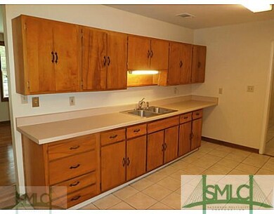 Kitchen. large kitchen has original cabinets with 