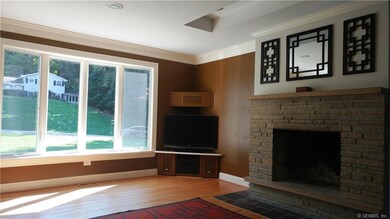 Beautiful front window in living room lets in lots of natural light.