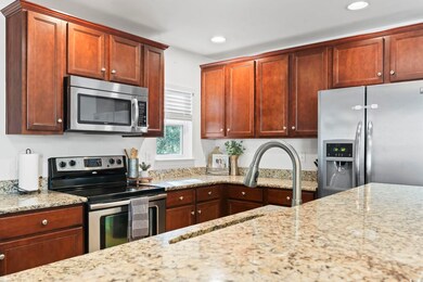 Kitchen featuring stainless steel appliances and l