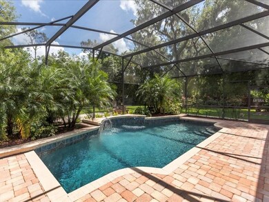 Sparkling solar heated screen enclosed pool with N