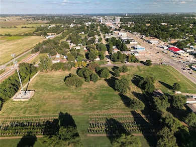Aerial overview of property's location with rural landscape and farmland