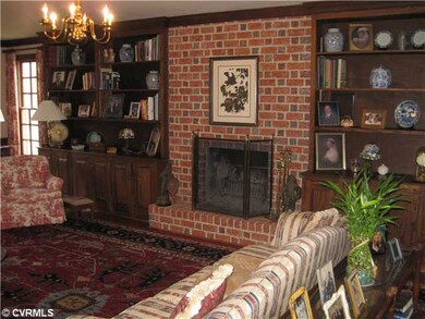 Den/Family/Great Room - Bookcases flank Masonry FP