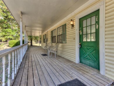 Covered front porch of 688 N Anderson-House sits o