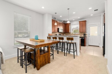 Dining space featuring light carpet, recessed lig