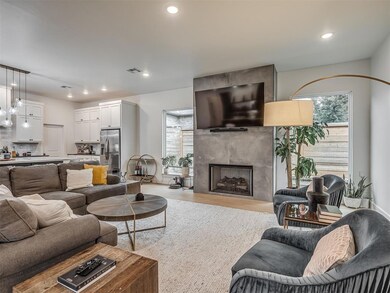 Living room featuring recessed lighting, a fireplace, and wood finished floors