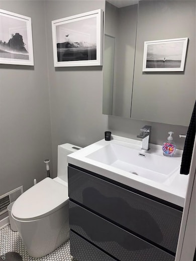 Bathroom with vanity and toilet