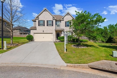 View of front facade featuring concrete driveway, 