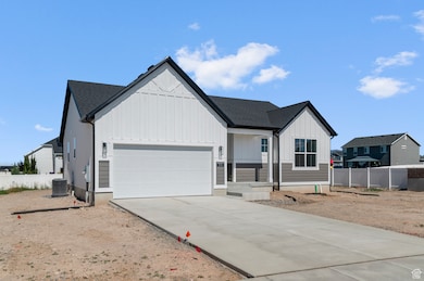 Modern farmhouse style home featuring board and batten siding, covered porch, concrete driveway, a garage, and a shingled roof
