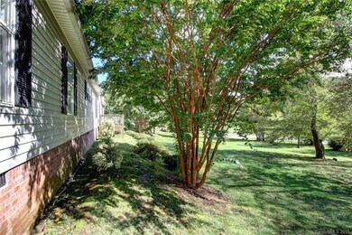 Nice landscaping providing shade and Spring flower