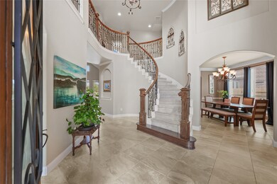 Inviting Entrance with elegant winding stairs