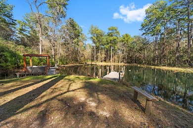 This serene property boasts a private pond surroun
