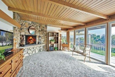 Step up to a light-filled formal living room with 