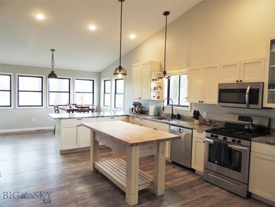 Large kitchen with island, granite countertops, an