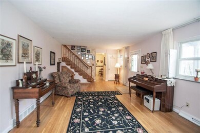 Another angle of living room looking back toward front door and kitchen.
