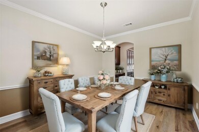 Dining area featuring a chandelier, ornamental mol