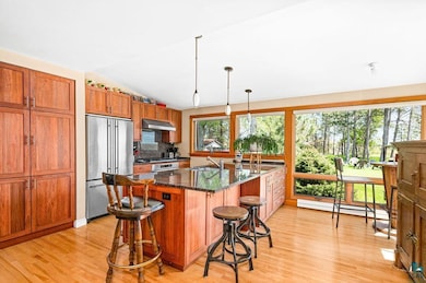 Kitchen featuring stainless steel refrigerator, pl