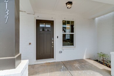 Some of the rowhouses feature large porches