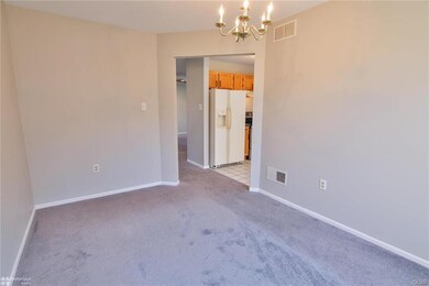 Dining room view towards kitchen & living room