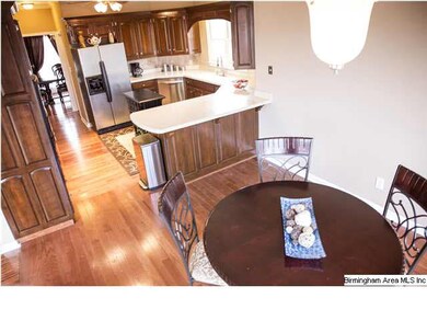 BREAKFAST BAR SEPERATES THE BREAKFAST ROOM FROM TH