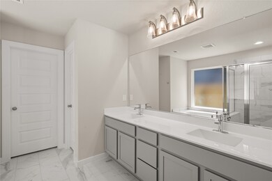 This primary bathroom is definitely move-in ready! Featuring cool stained cabinets with light countertops, spacious walk-in closet with shelving, high ceilings, custom paint, sleek and dark modern finishes.

