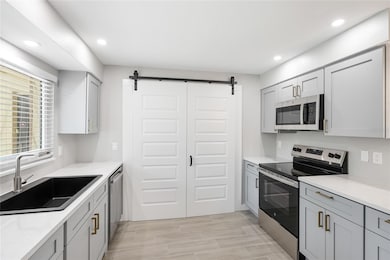 Washer & dryer beyond doors