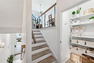 Entrance from garage looks down to ground floor bedroom and ensuite and up a few steps to the main living area