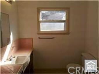 Nice bath room with a tub and a shower.