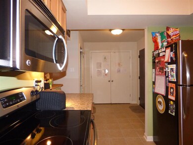 Wide entryway with over-sized closet & door to cov