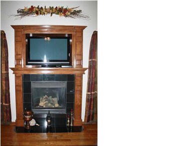 Fireplace surrounded with granite & gorgeous woodw
